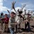 Young boys catch and rope their favourite reindeers to harness up for a ride into the forest.